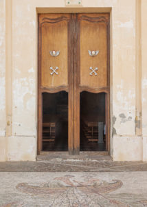 Sicily - Sunny impressions of the Aeolian Islands, also known as Aeolian Islands or Isole Eolie: Lipari, Stromboli, Salina, Vulcano, Panarea, Filicudi and Alicudi. Entrance door to the Chiesa di San Pietro church in Panarea. Sicily - Sunny impressions of the Aeolian Islands, also known as Aeolian Islands or Isole Eolie: Lipari, Stromboli, Salina, Vulcano, Panarea, Filicudi and Alicudi. Entrance door to the Chiesa di San Pietro church in Panarea.
